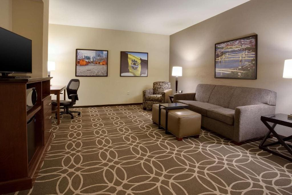 Queen Suite with Two Queen Beds and Sofa Bed room - Image 2