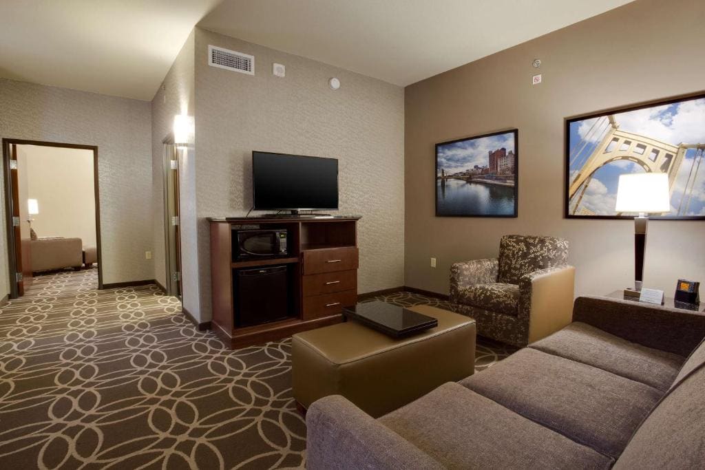 Queen Suite with Two Queen Beds and Sofa Bed room - Image 1