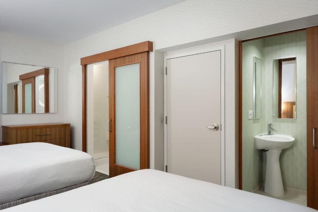 Queen Suite with Two Queen Beds and Trundle Sofa room - Image 2