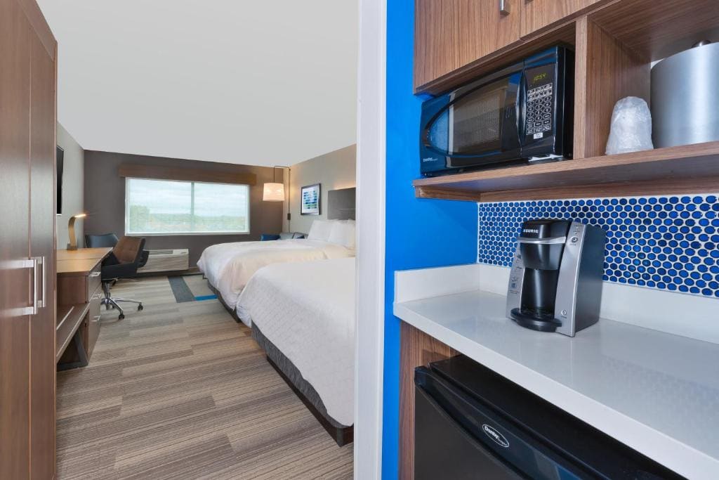 Queen Suite with Two Queen Beds and Sofa Bed room - Image 1