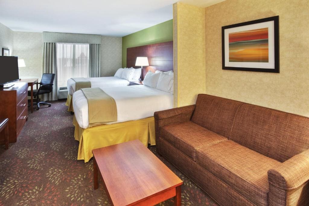 Queen Suite with Two Queen Beds and Sofa Bed room - Image 1