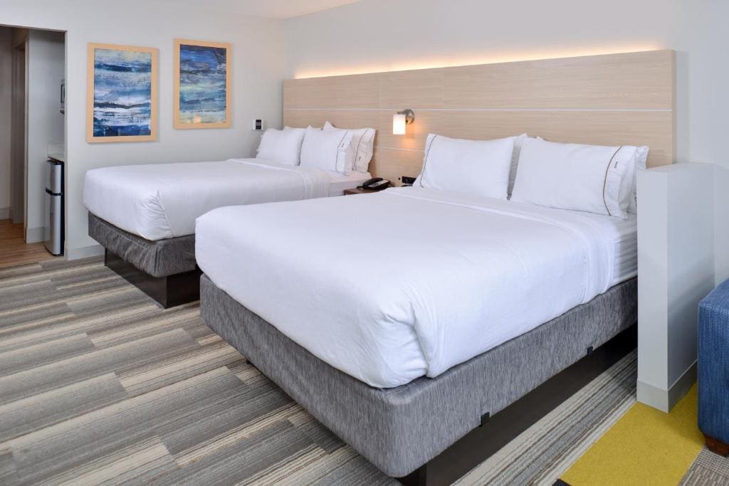 Queen Suite with Two Queen Beds and Sofa Bed room - Image 1