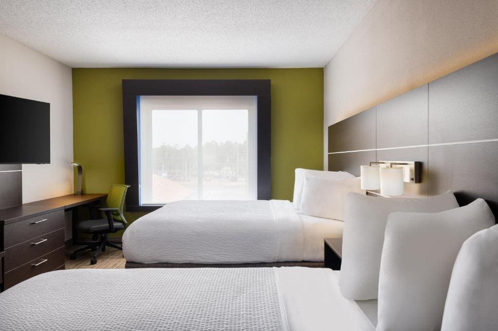 Queen Suite with Two Queen Beds and Sofa Bed room - Image 1