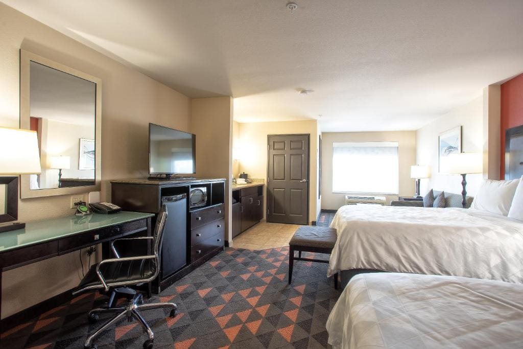 Queen Suite with Two Queen Beds and Sofa Bed room - Image 2