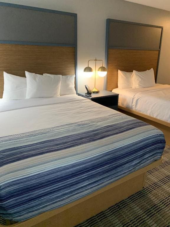 Queen Room with Two Queen Beds, Mobility Access and Bathtub with Grab Bars, Non-Smoking room - Image 1
