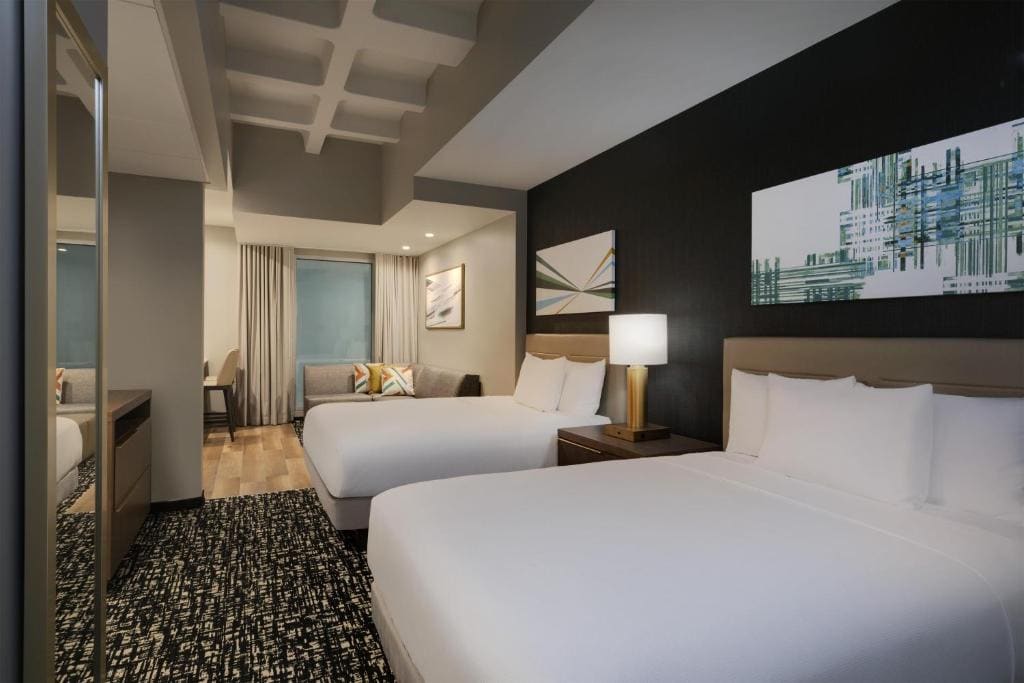 Studio Kitchen Suite (Interior Room) | Two Queen Beds (Plus Sofa Bed) room - Image 2
