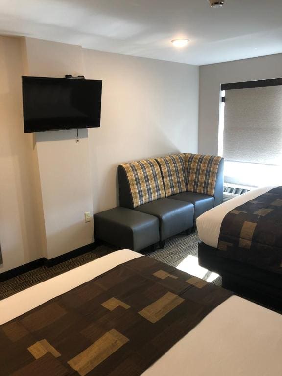 Deluxe Queen Room with Two Queen Beds room - Image 3