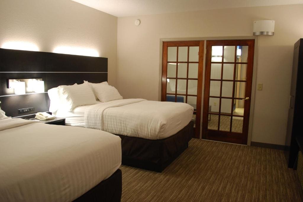 Queen Suite with Two Queen Beds and Sofa Bed room - Image 1