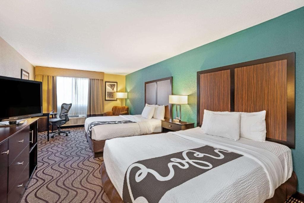 Deluxe Queen Room with Two Queen Beds room - Image 1