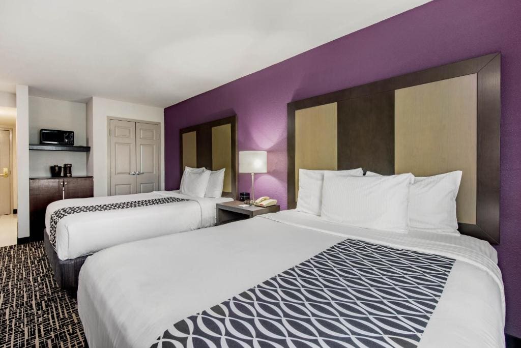 Deluxe Queen Room with Two Queen Beds room - Image 1