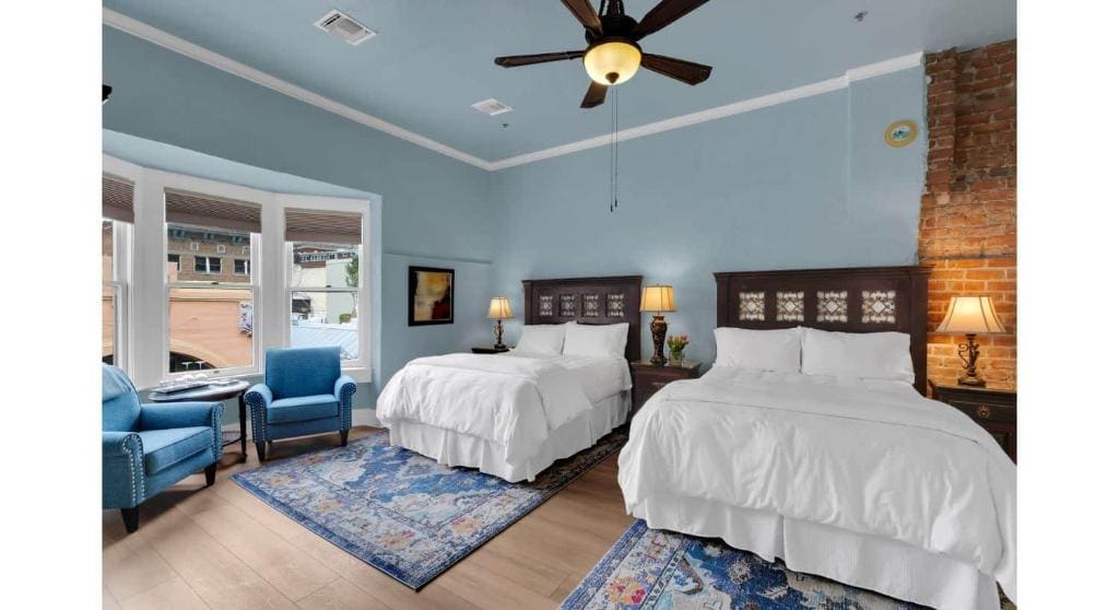 Deluxe Queen Room with Two Queen Beds room - Image 1
