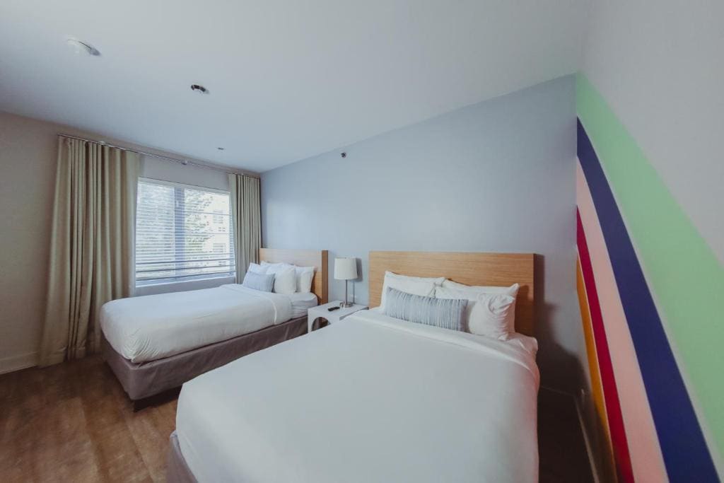 Deluxe Queen Room with Two Queen Beds room - Image 2