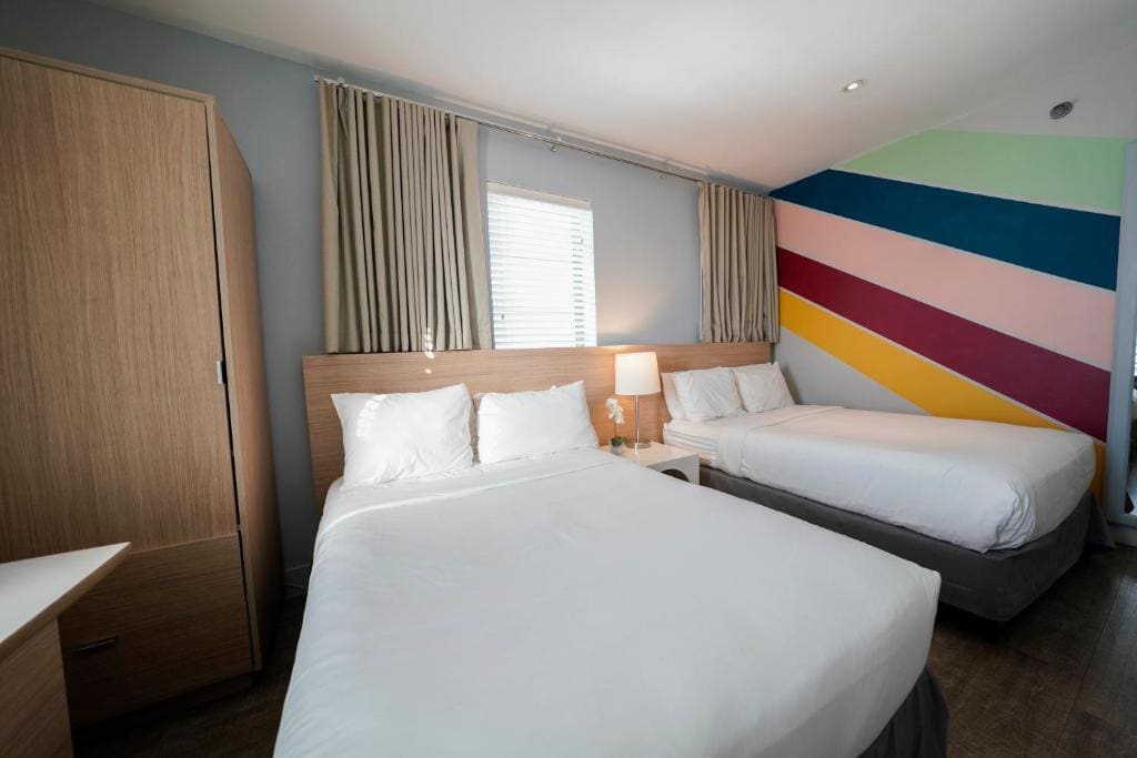 Deluxe Queen Room with Two Queen Beds room - Image 1