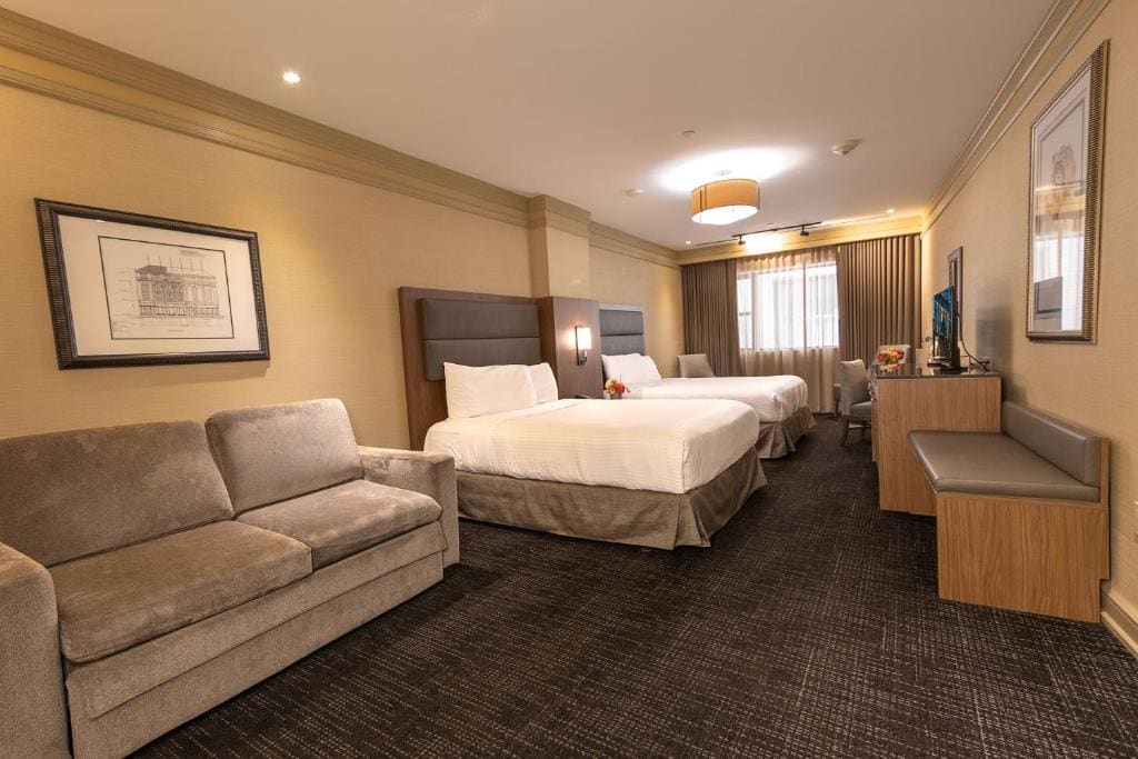 Deluxe Queen Room with Two Queen Beds room - Image 1