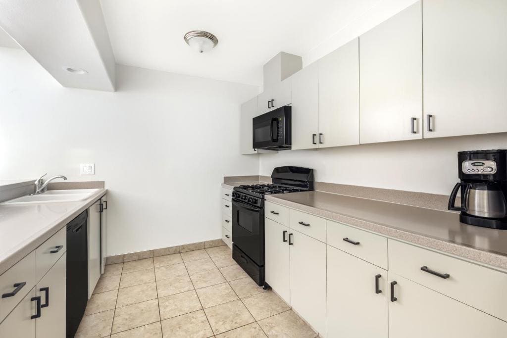 Three-Bedroom King Suite with Two Queen Beds and Balcony room - Image 1