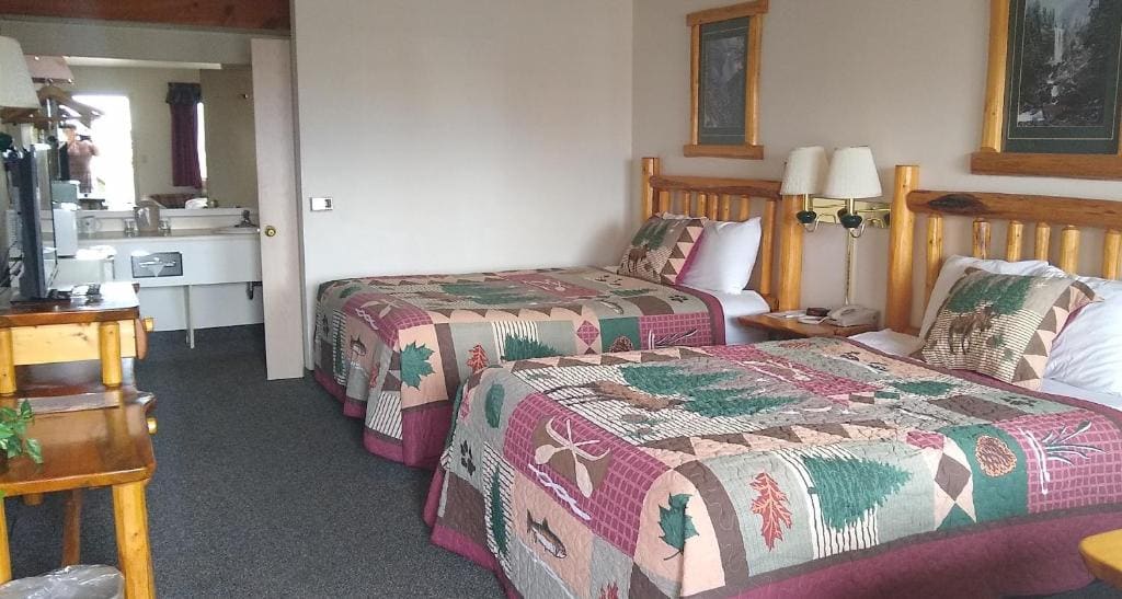 Deluxe Queen Room with Two Queen Beds room - Image 2