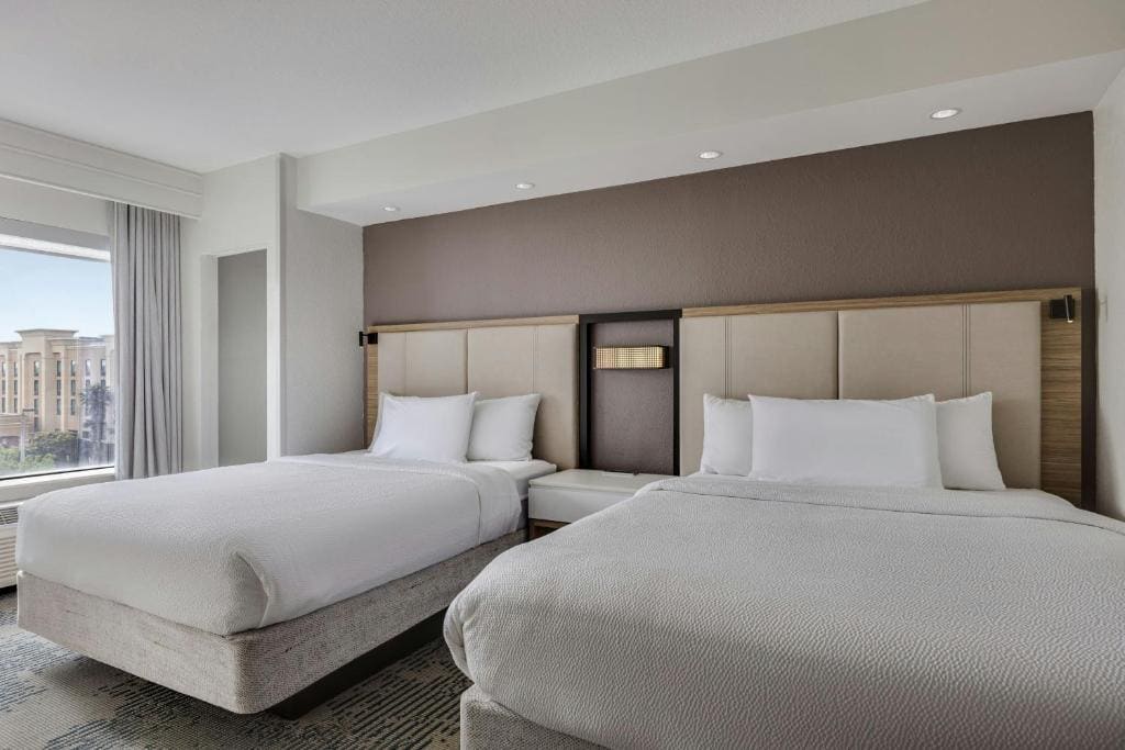 Queen Suite with Two Queen Beds and Trundle Sofa room - Image 1