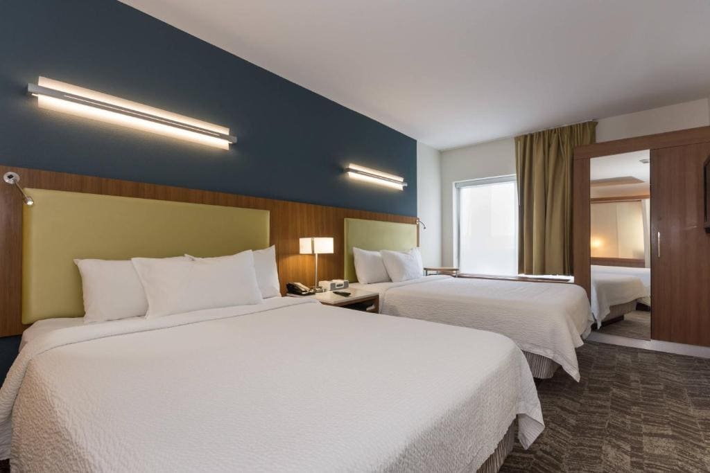 Queen Suite with Two Queen Beds and Sofa Bed room - Image 2