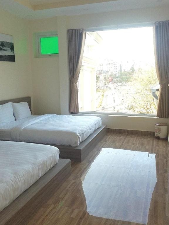 Deluxe Queen Room with Two Queen Beds room - Image 2
