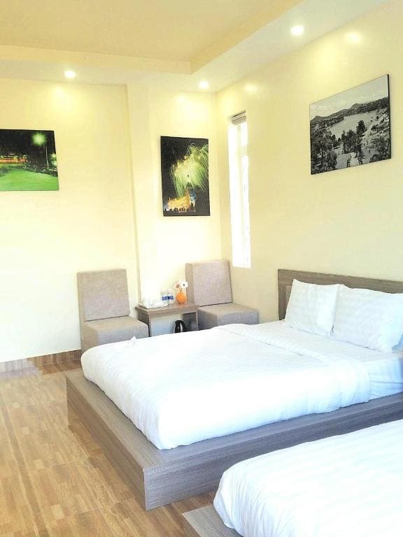 Deluxe Queen Room with Two Queen Beds room - Image 1