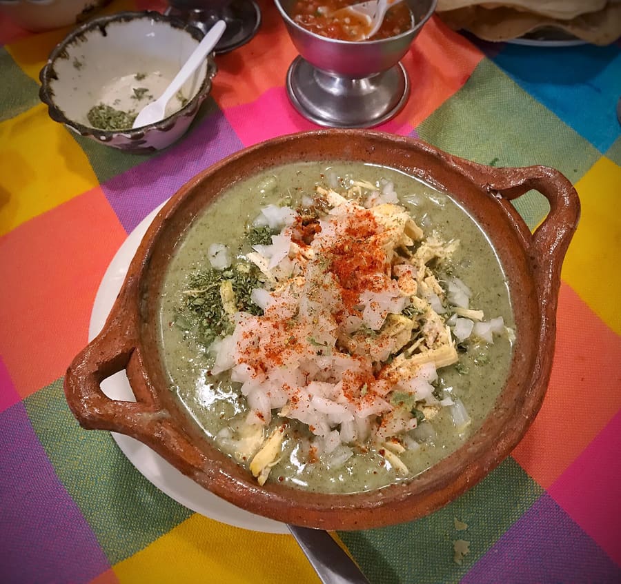 Traditional Guerrero green pozole served with local garnishes.
