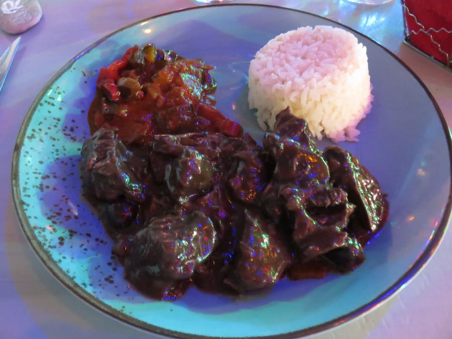 Gardianne de taureau, a traditional slow-cooked bull stew served with Camargue red rice.