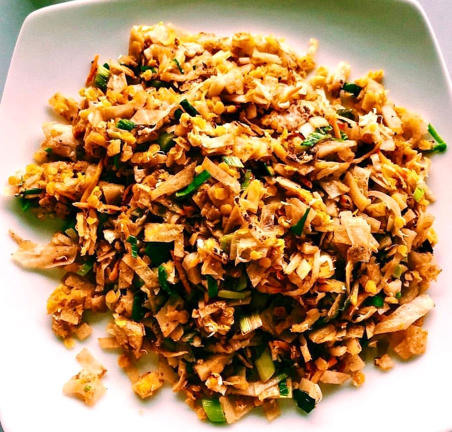 Kottu roti chopped fresh on hot iron griddles along Panama Road.