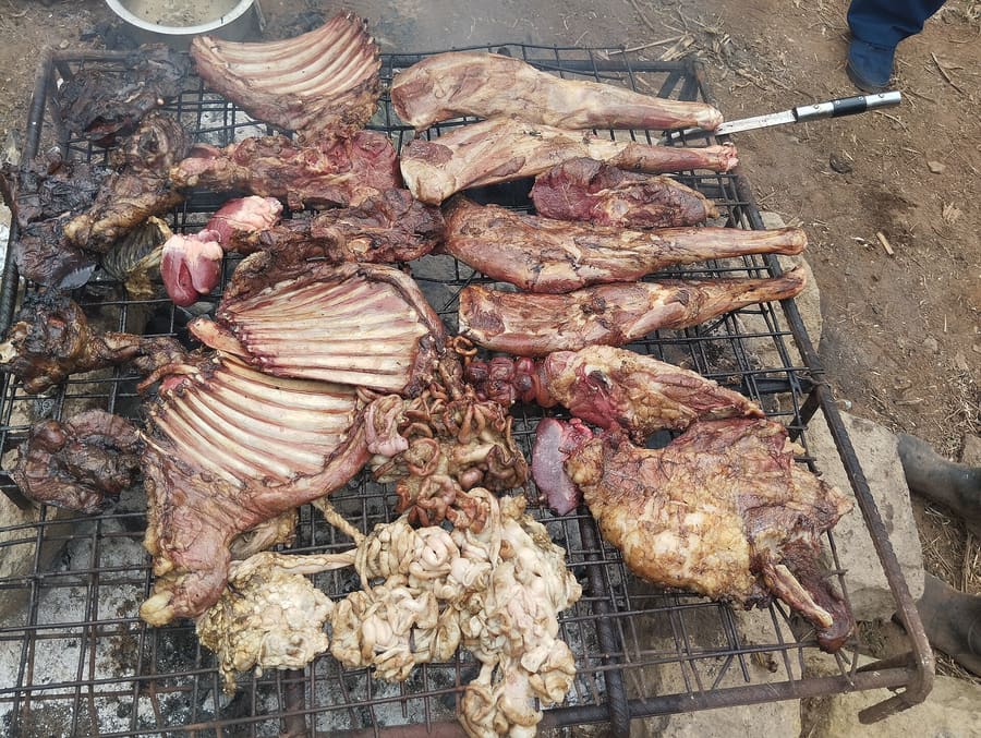 Freshly grilled goat meat served with ugali and kachumbari salad.