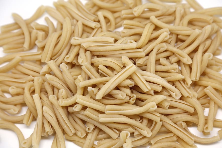 Strangozzi pasta served with black truffle sauce in a traditional Umbrian trattoria.
