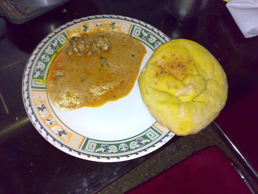 Slow-simmered Naan Qalia served with fresh tandoor naan at an old city restaurant.