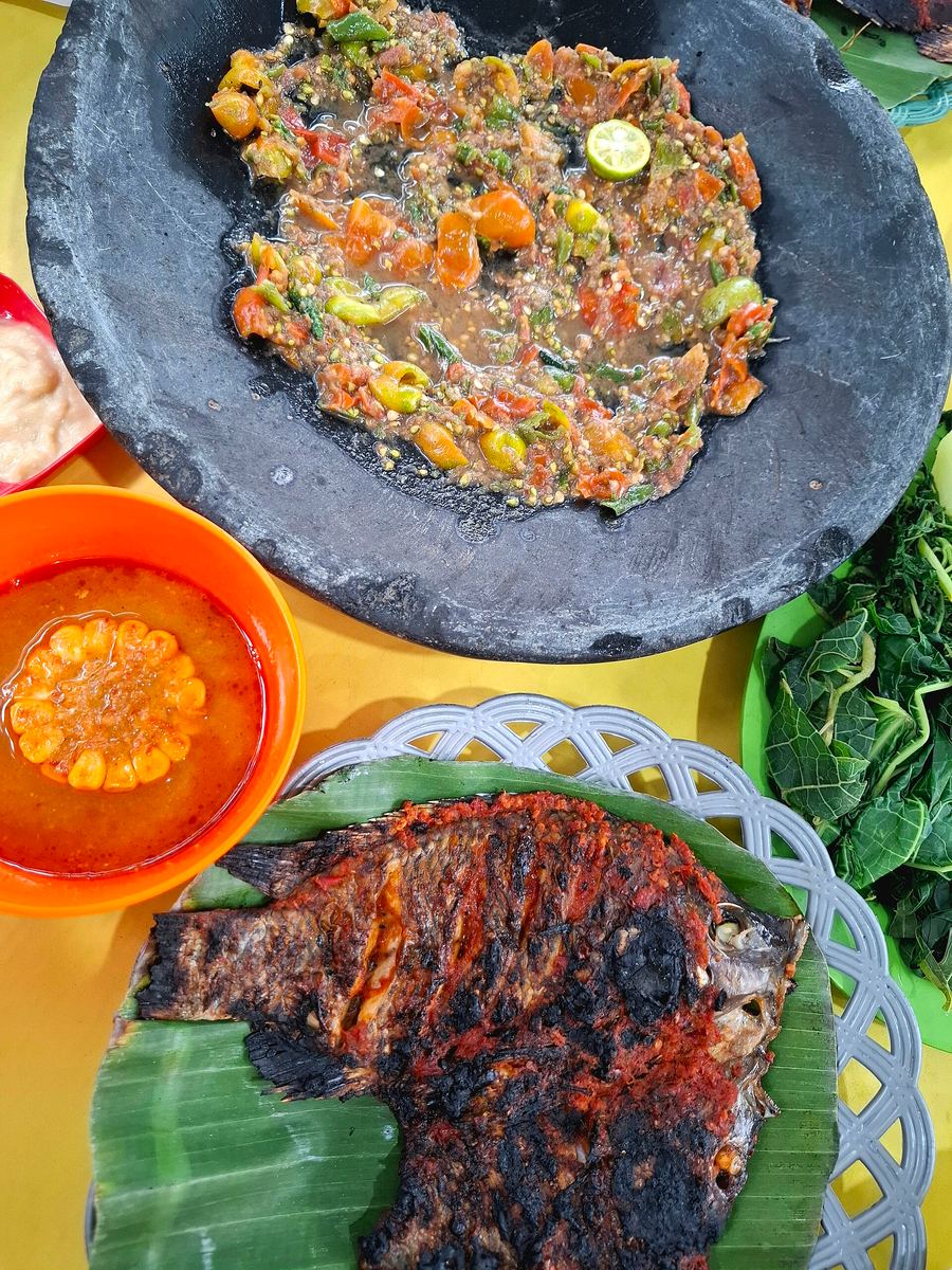 Seruit served with grilled river fish, sambal terasi, and tempestuous tempoyak fermented durian paste.