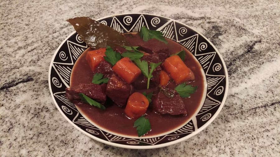 Boeuf bourguignon served in a traditional cast-iron pot in central Beaune.