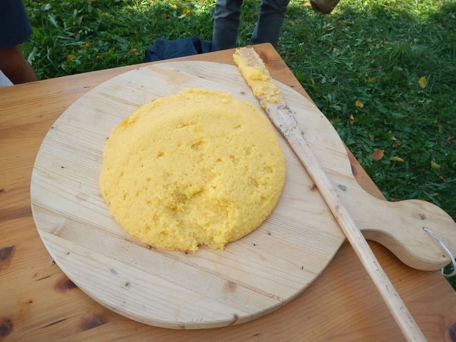 Traditional polenta prepared in copper kettles across the Lake Como region.