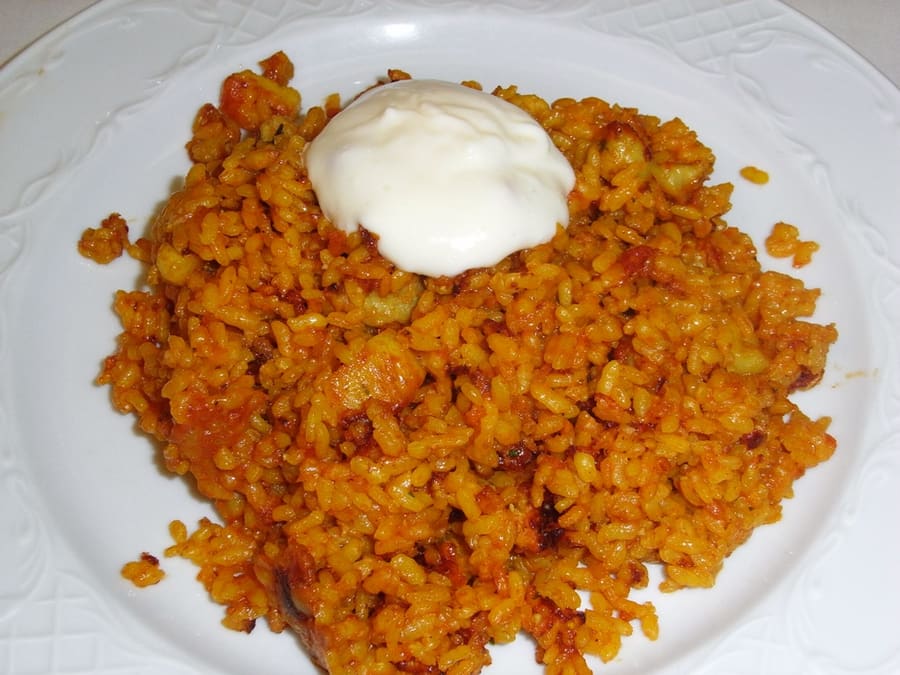 Arroz a banda cooked in rich fish stock, served with homemade garlic alioli.