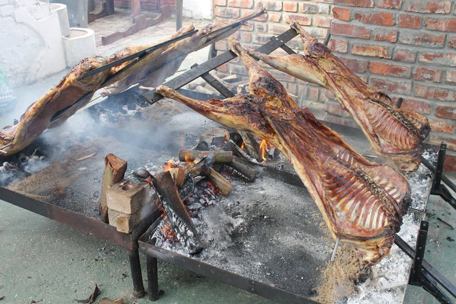Parrillas grill beef cuts over slow hardwood coals across the city.