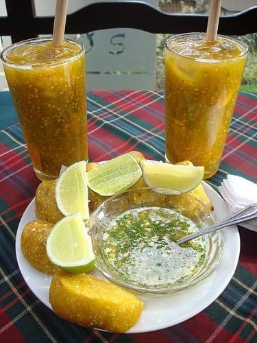 Lulada, a traditional cold beverage made from mashed lulo fruit, lime, and crushed ice.