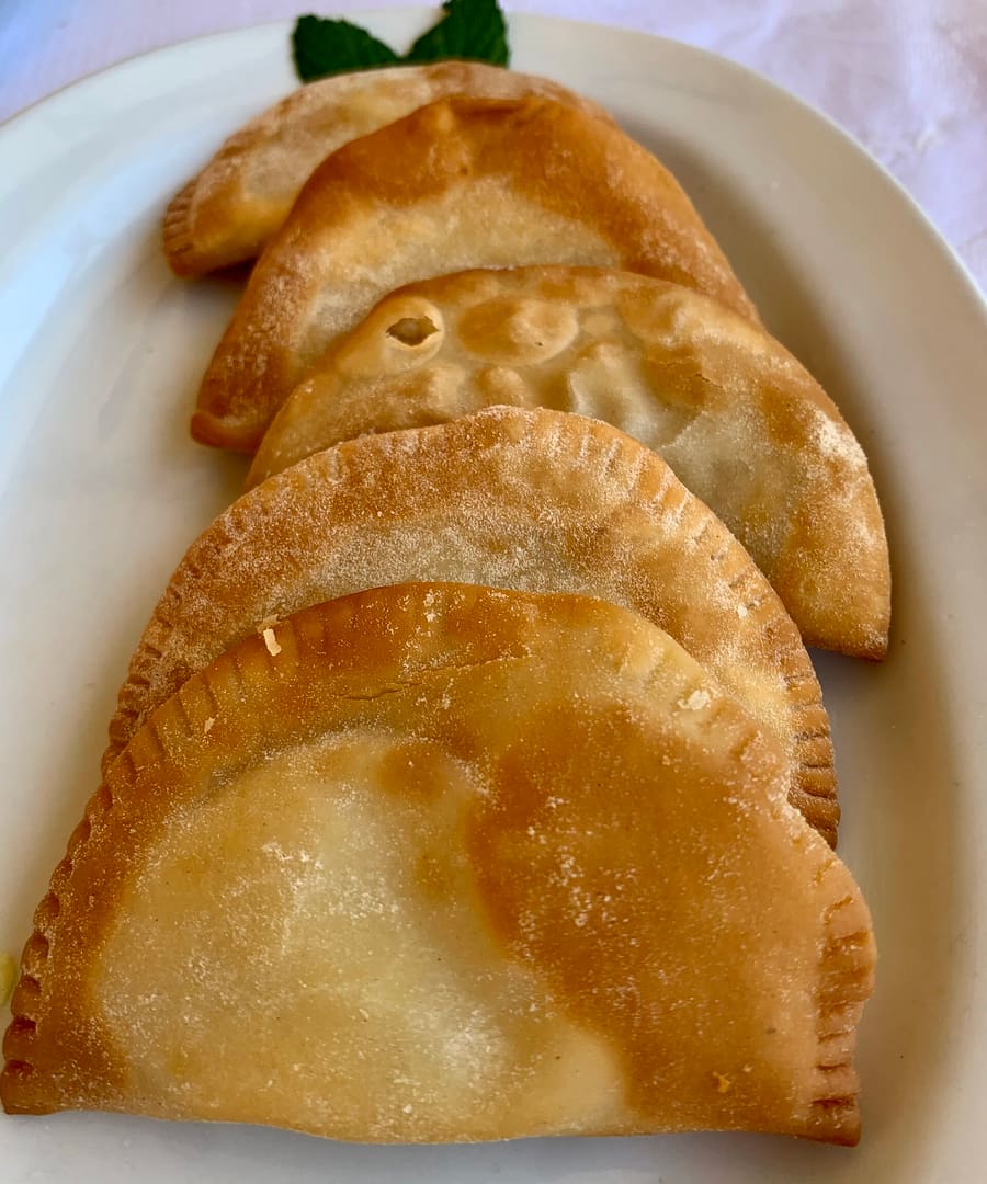 Freshly baked kalitsounia pastries served at a local baker.
