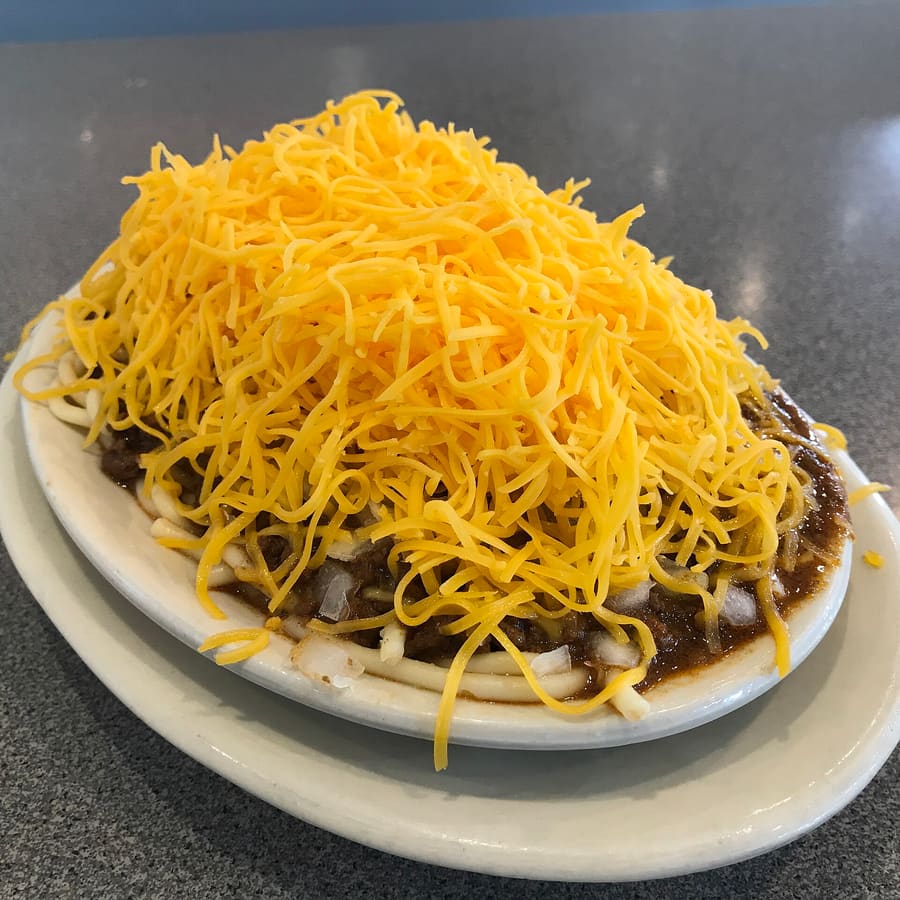 A classic Cincinnati three-way chili plate with spaghetti and cheddar.
