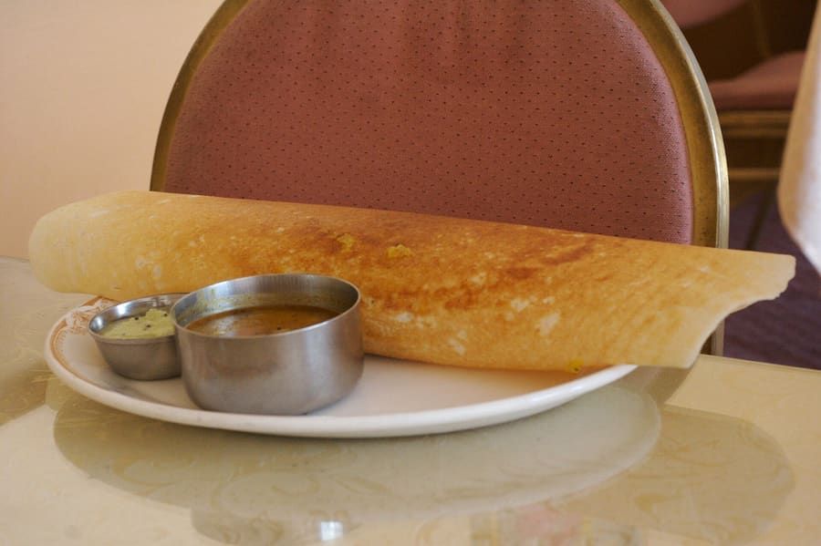 A classic vegetarian tiffin spread served on banana leaf in Coimbatore.