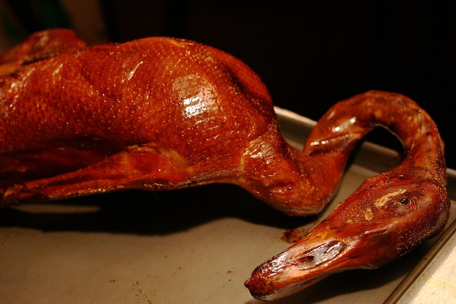 A bowl of Dongguan roast goose laifen served in thick goose stock.
