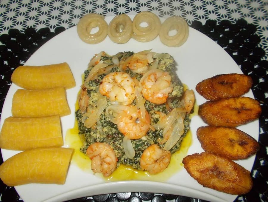 Ndolé served with boiled plantains at a local restaurant.