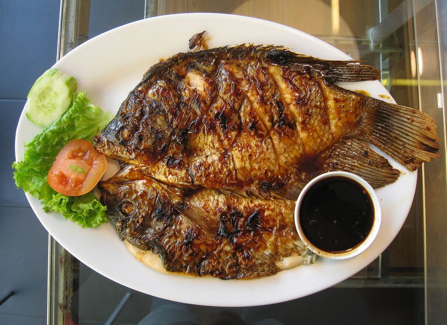 Whole snapper grilled over coconut charcoal at the night market.