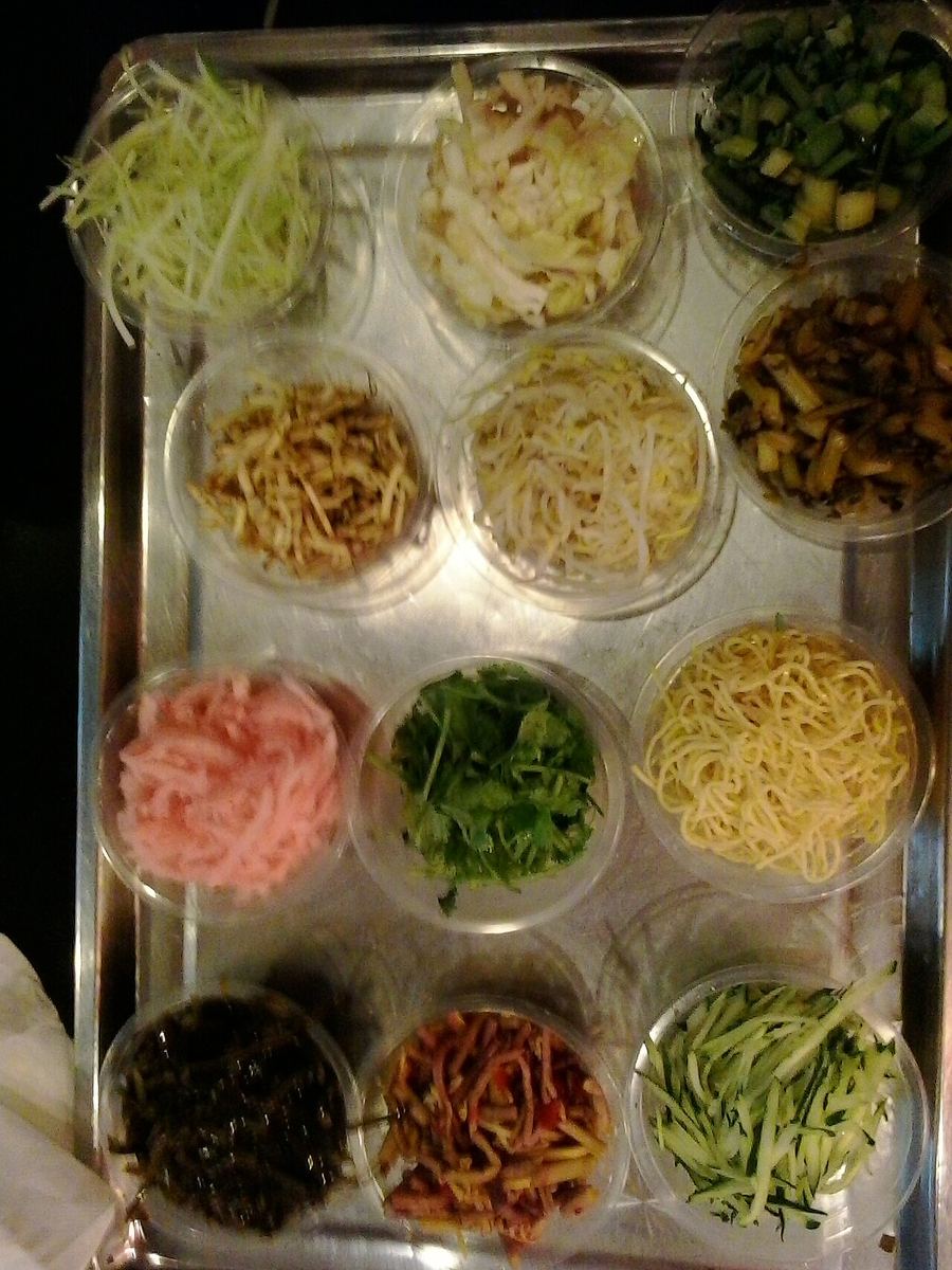 Siwawa features dozens of shredded vegetable strips wrapped in thin rice pancakes.