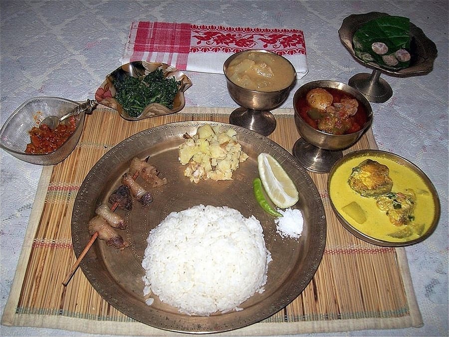 A traditional Assamese meal served in bell-metal kansa dishes.
