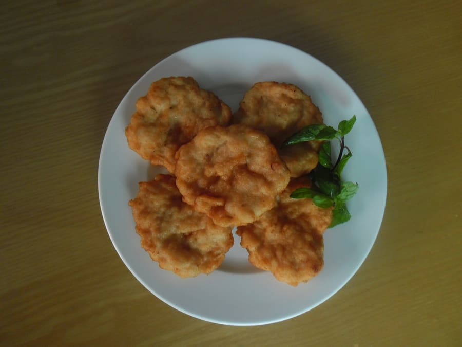 Chả Mực served hot with steamed rice crepes or sticky rice.