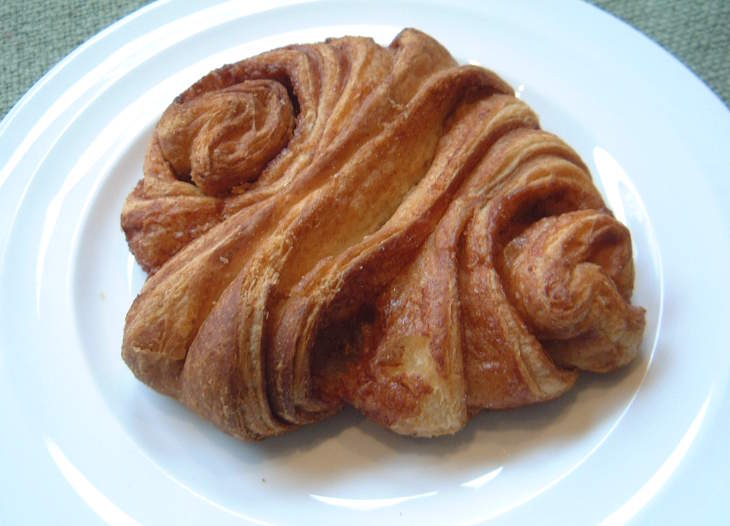A fresh Franzbrötchen, Hamburg's signature caramelized cinnamon pastry.