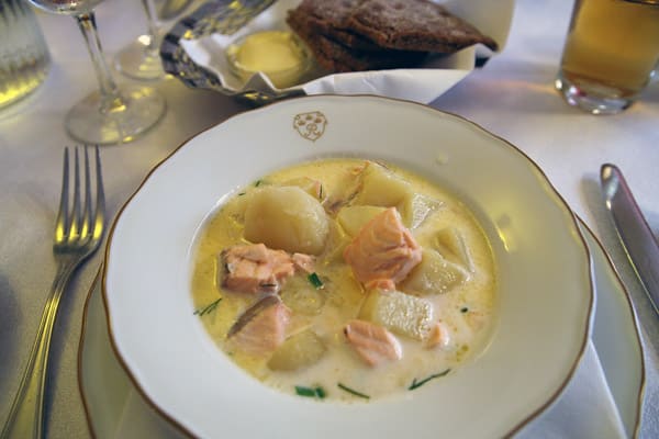 Lohikeitto, traditional Finnish salmon soup cooked with butter, potatoes, and fresh dill.