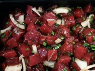 Fresh ahi tuna poke made with sea salt, shoyu, and sea lettuce.