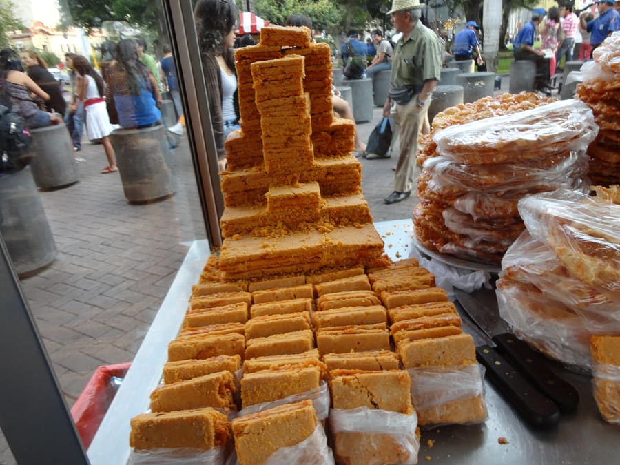 Freshly cut chumbeque pastries layered with mango and passion fruit syrup.