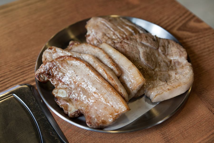 Thick cuts of Jeju black pork cooked over charcoal with salted anchovy dip.